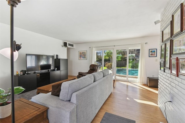 living room featuring light wood-style floors and french doors