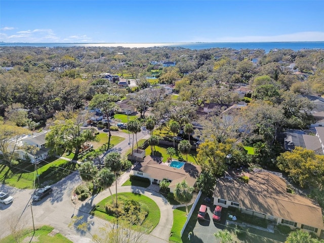 drone / aerial view with a water view and a residential view