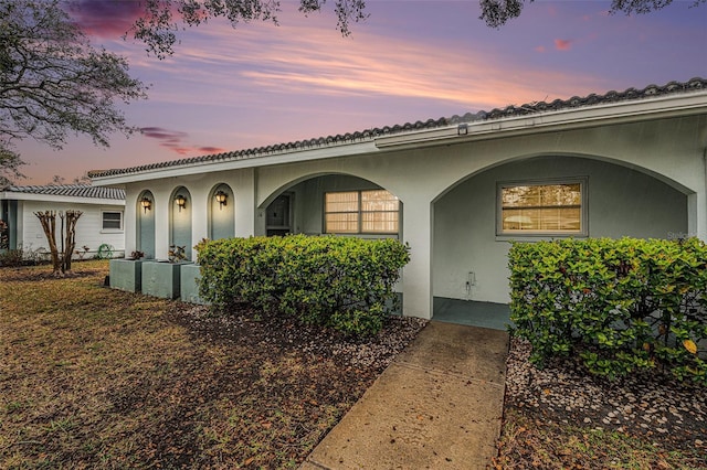 view of front of house featuring stucco siding