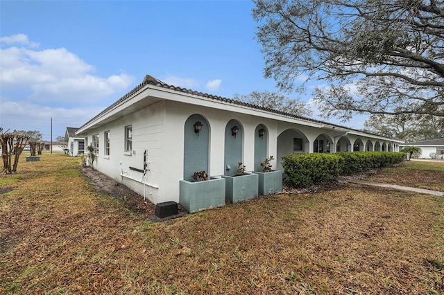 view of property exterior featuring a yard