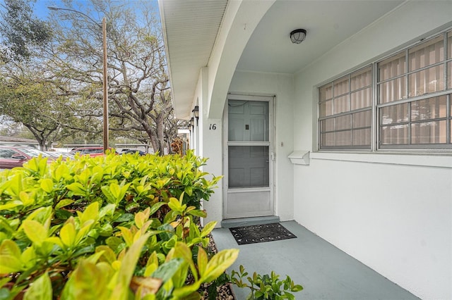 view of exterior entry with stucco siding