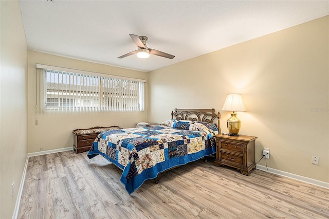 bedroom featuring light wood-style flooring, baseboards, and ceiling fan