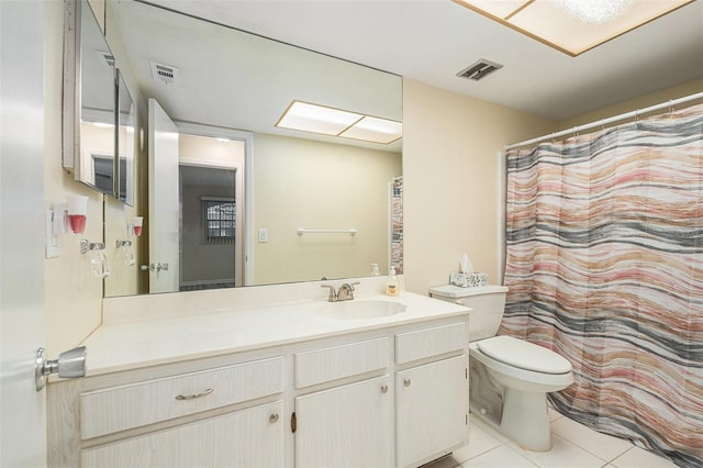 bathroom featuring toilet, tile patterned flooring, visible vents, and vanity