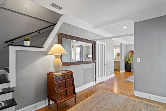 corridor featuring light hardwood / wood-style floors