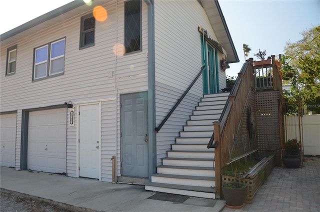 view of side of home with a garage