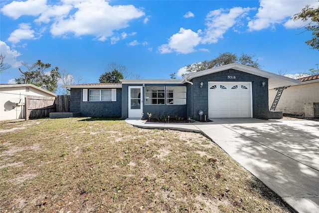 single story home with a garage and a front yard