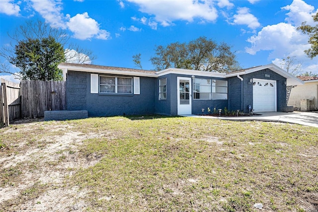 single story home with a garage and a front yard