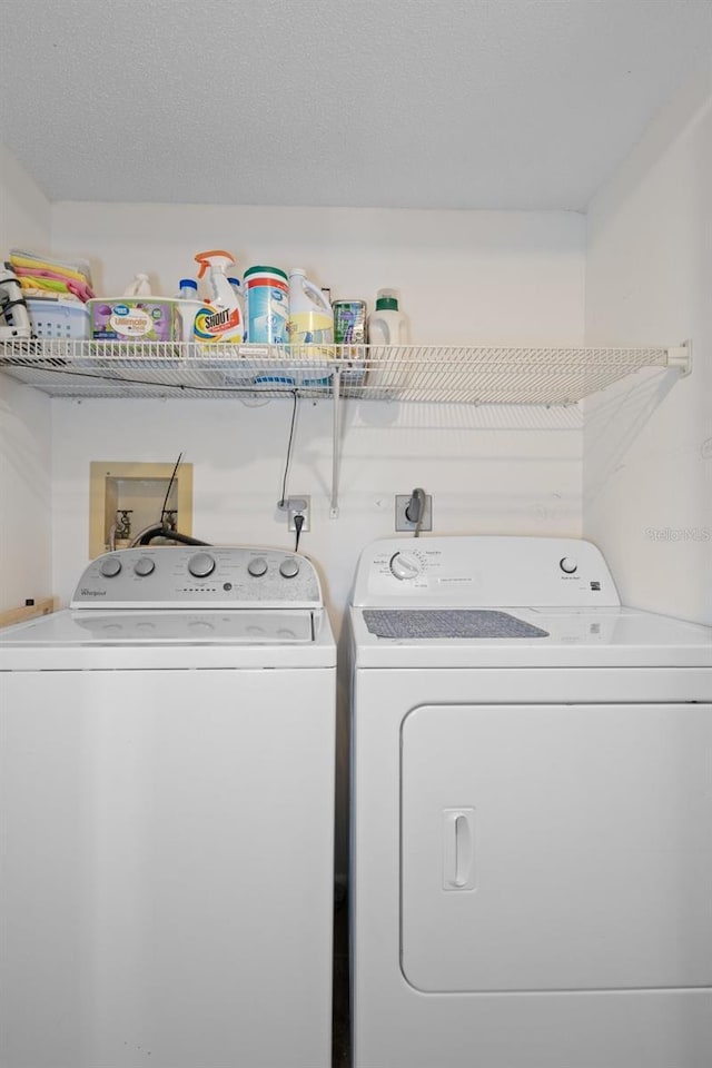 washroom featuring washing machine and dryer