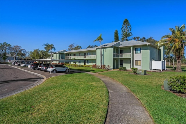 128 Nancy Dr Unit 128, Oldsmar, FL 34677 - view of building exterior with covered parking