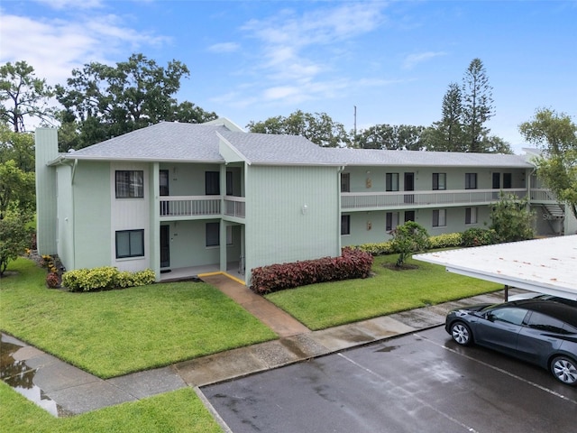 128 Nancy Dr Unit 128, Oldsmar, FL 34677 - view of property with uncovered parking