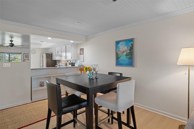 128 Nancy Dr Unit 128, Oldsmar, FL 34677 - dining space featuring ceiling fan, light wood-style floors, crown molding, and recessed lighting