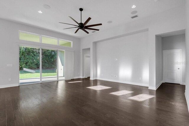 interior space with dark wood-type flooring, recessed lighting, ceiling fan, and baseboards