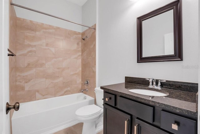 bathroom featuring toilet, shower / bathing tub combination, and vanity