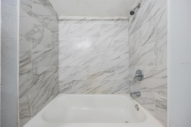 bathroom with washtub / shower combination