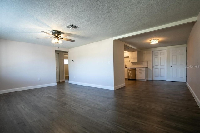 unfurnished living room featuring dark hardwood / wood-style flooring, a textured ceiling, and ceiling fan