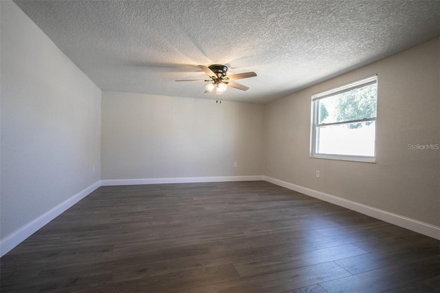 spare room with ceiling fan, dark hardwood / wood-style flooring, and a textured ceiling