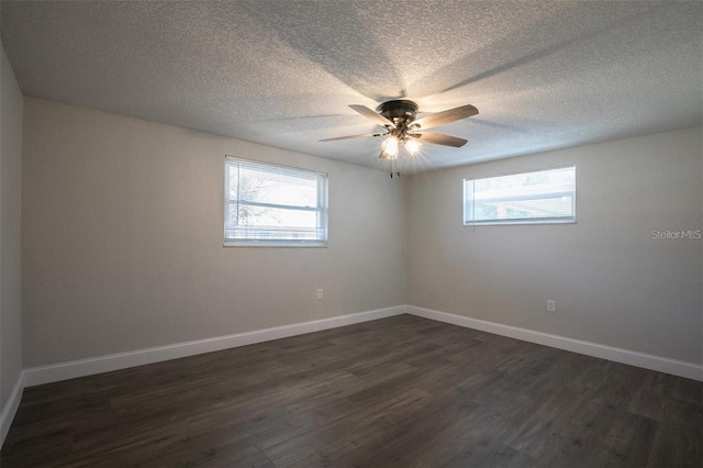 spare room featuring ceiling fan, a textured ceiling, and dark hardwood / wood-style flooring