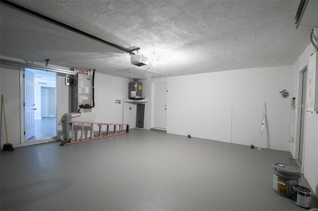 garage with water heater, heating unit, and a garage door opener