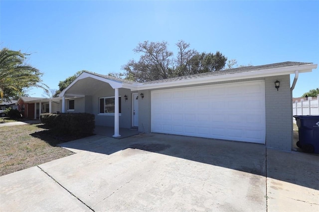 ranch-style home featuring a garage