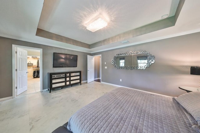 bedroom with a tray ceiling