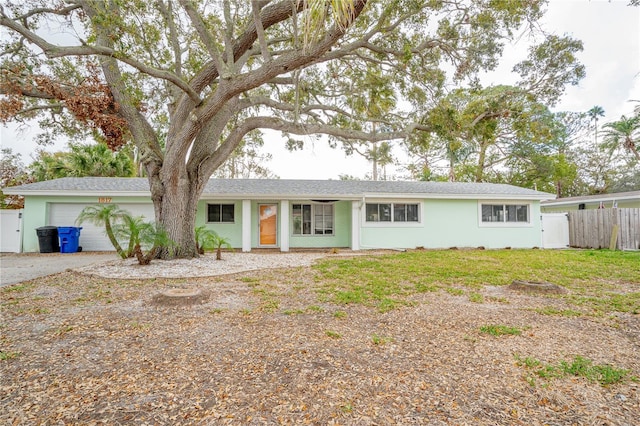 ranch-style home with a garage