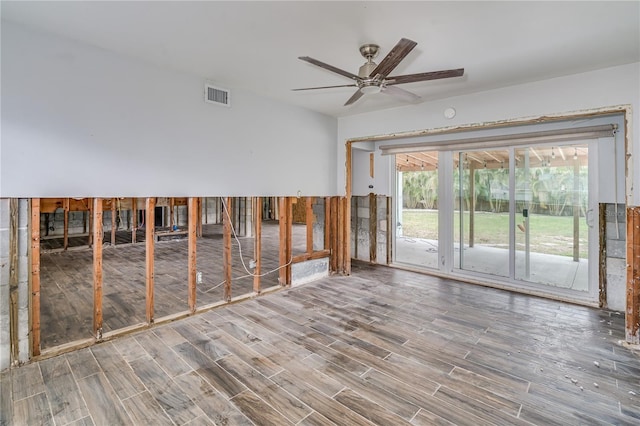 empty room with hardwood / wood-style flooring and ceiling fan