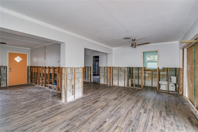 empty room with crown molding, ceiling fan, and hardwood / wood-style floors