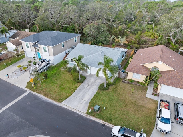 45 Gulfwinds Dr W, Palm Harbor, FL 34683 - aerial view of property and surrounding area featuring a heavily wooded area