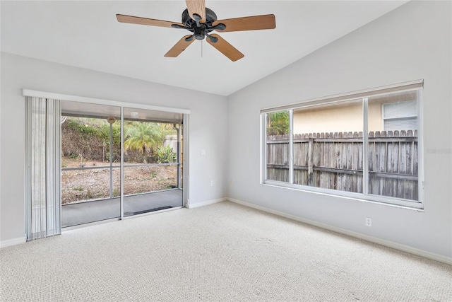 45 Gulfwinds Dr W, Palm Harbor, FL 34683 - spare room with carpet floors, baseboards, vaulted ceiling, and a ceiling fan