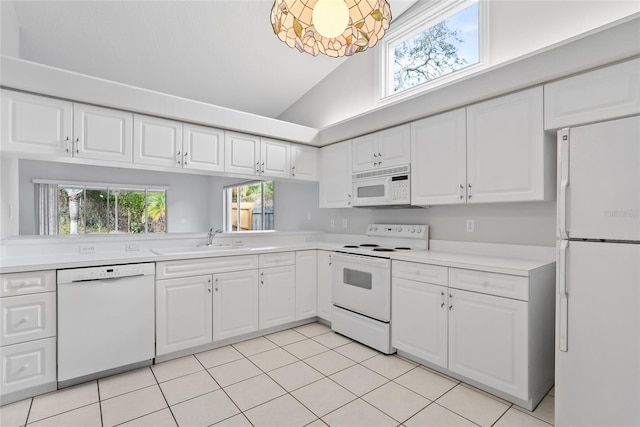 45 Gulfwinds Dr W, Palm Harbor, FL 34683 - kitchen featuring white appliances, light tile patterned floors, light countertops, a sink, and white cabinetry