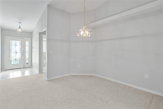 45 Gulfwinds Dr W, Palm Harbor, FL 34683 - carpeted foyer entrance with a chandelier and baseboards