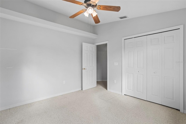 45 Gulfwinds Dr W, Palm Harbor, FL 34683 - unfurnished bedroom with baseboards, carpet, a closet, and ceiling fan