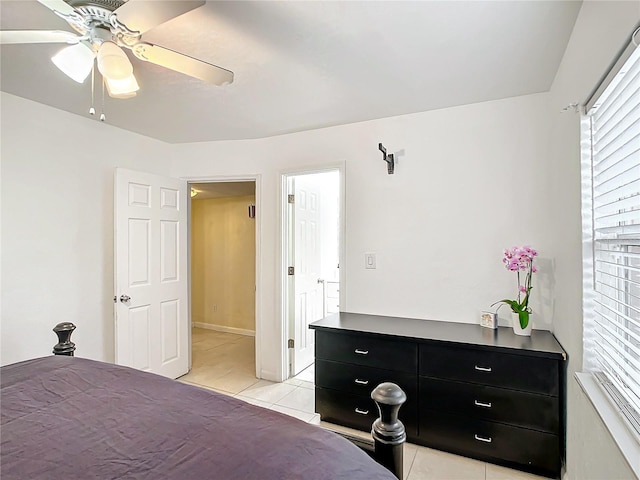 tiled bedroom with ceiling fan