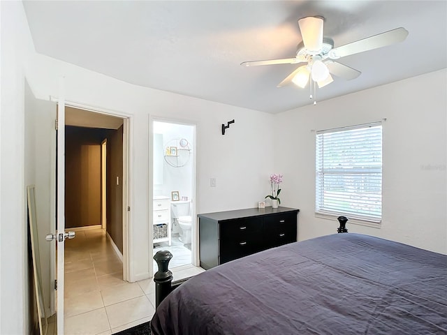 tiled bedroom with ceiling fan and ensuite bathroom