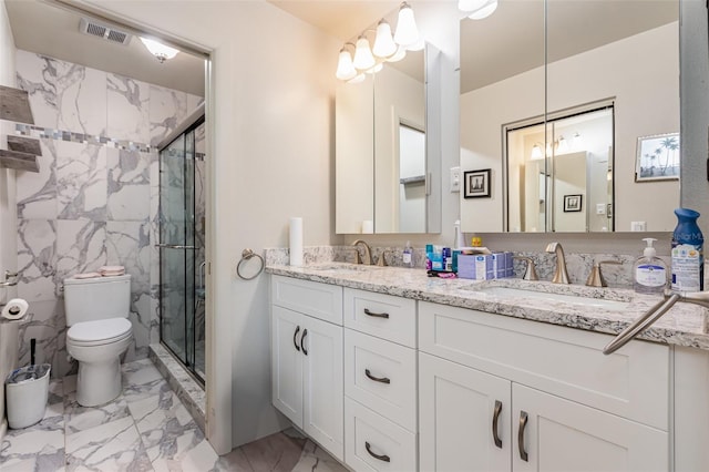 bathroom with vanity, toilet, and walk in shower