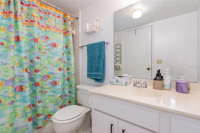 bathroom with a shower with curtain, vanity, and toilet