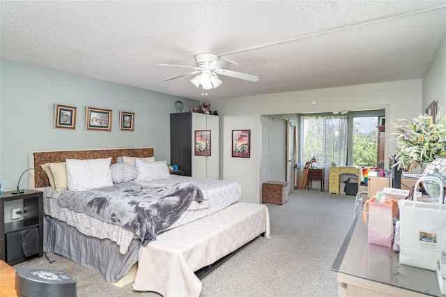 127 Tidewater Dr Unit 127, Bradenton, FL 34210 - bedroom featuring a textured ceiling, ceiling fan, and carpet floors