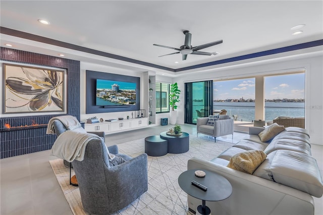 tiled living room with ceiling fan