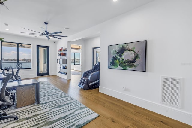 office space with hardwood / wood-style flooring and ceiling fan