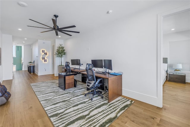 office featuring ceiling fan and light hardwood / wood-style floors