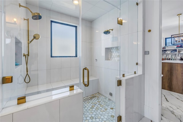 bathroom featuring a shower with shower door