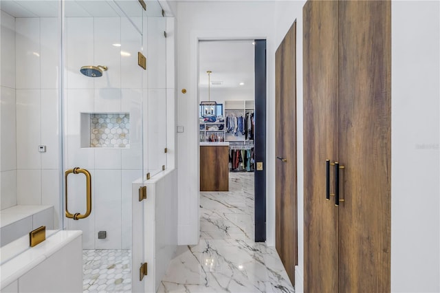 bathroom featuring tile walls and a shower with shower door