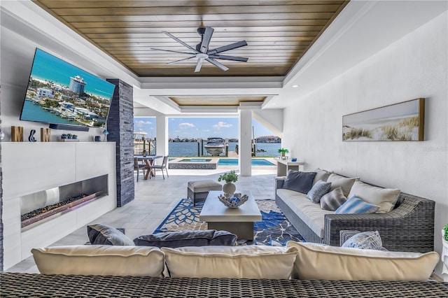 living room with a raised ceiling and wooden ceiling