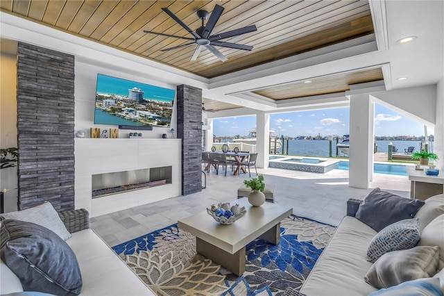 living room featuring a fireplace, ceiling fan, a raised ceiling, and wooden ceiling