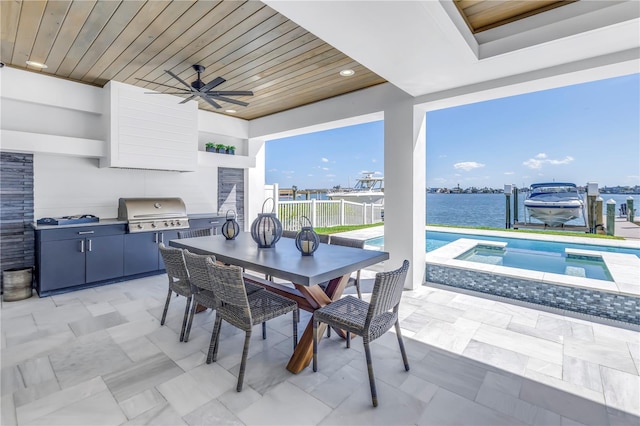 view of patio with exterior kitchen, a water view, grilling area, a pool with hot tub, and ceiling fan