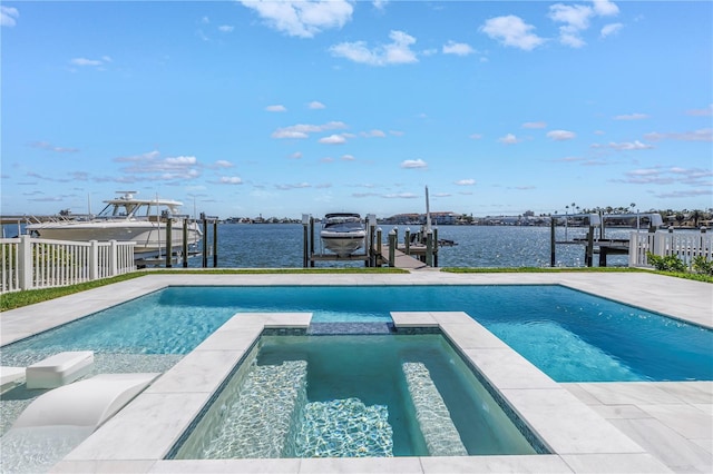 view of swimming pool featuring an in ground hot tub, a water view, and a boat dock