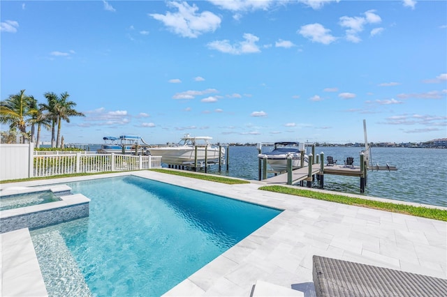 view of swimming pool featuring a dock, a water view, a patio area, and an in ground hot tub