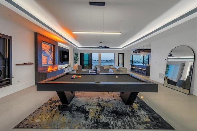 playroom with a raised ceiling, ceiling fan, and billiards