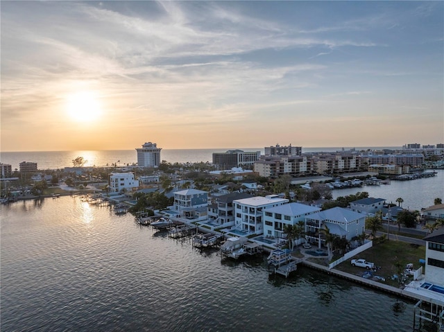 aerial view at dusk with a water view