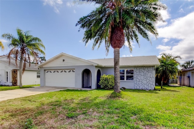 7034 Southwind Dr, Hudson, FL 34667 - single story home featuring an attached garage, stucco siding, driveway, and a front yard